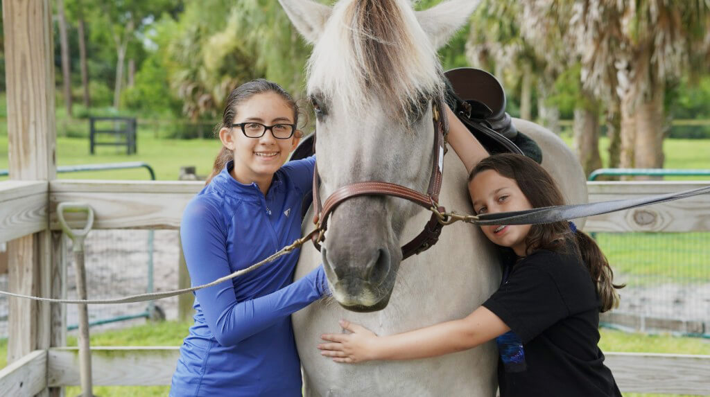 two-girls-white-horse-home